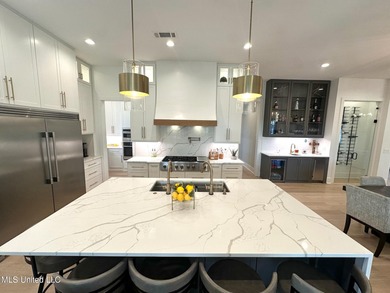 Discover modern elegance in this stunning home located in the on Reunion Golf Club in Mississippi - for sale on GolfHomes.com, golf home, golf lot