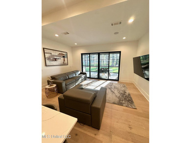 Discover modern elegance in this stunning home located in the on Reunion Golf Club in Mississippi - for sale on GolfHomes.com, golf home, golf lot