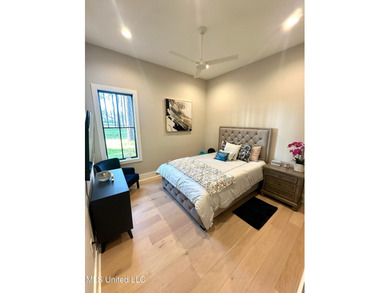 Discover modern elegance in this stunning home located in the on Reunion Golf Club in Mississippi - for sale on GolfHomes.com, golf home, golf lot