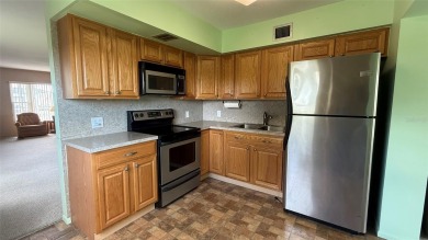 Welcome to this beautiful 2-bedroom, 2-bath END unit condo in on On Top Of The World Golf Course in Florida - for sale on GolfHomes.com, golf home, golf lot