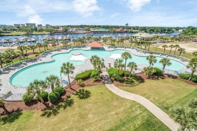 This top floor, fully furnished condo at River Crossing in on Barefoot Resort and Golf Club - Norman Course in South Carolina - for sale on GolfHomes.com, golf home, golf lot