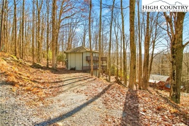 Charming Mountain Retreat: 3-Bedroom, 2-Bath Round House on Beech Mountain Club in North Carolina - for sale on GolfHomes.com, golf home, golf lot