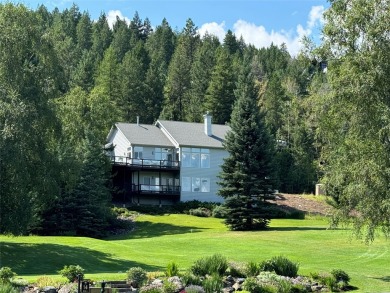 Enjoy expansive views of the mountains over the golf course from on Whitefish Lake Golf Club in Montana - for sale on GolfHomes.com, golf home, golf lot