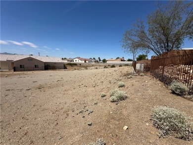 Nestled inside the gated Los Lagos community, this oversized lot on Los Lagos Golf Club in Arizona - for sale on GolfHomes.com, golf home, golf lot