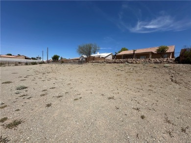 Nestled inside the gated Los Lagos community, this oversized lot on Los Lagos Golf Club in Arizona - for sale on GolfHomes.com, golf home, golf lot