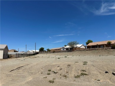Nestled inside the gated Los Lagos community, this oversized lot on Los Lagos Golf Club in Arizona - for sale on GolfHomes.com, golf home, golf lot
