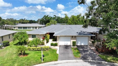 Welcome to this charming and spacious 2-bedroom, 2-bath end-unit on Palm Aire Country Club of Sarasota in Florida - for sale on GolfHomes.com, golf home, golf lot