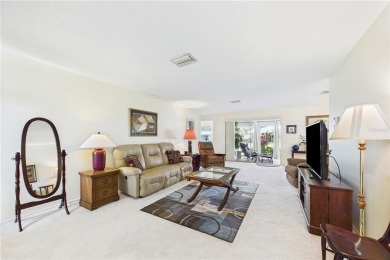 Welcome to this charming and spacious 2-bedroom, 2-bath end-unit on Palm Aire Country Club of Sarasota in Florida - for sale on GolfHomes.com, golf home, golf lot