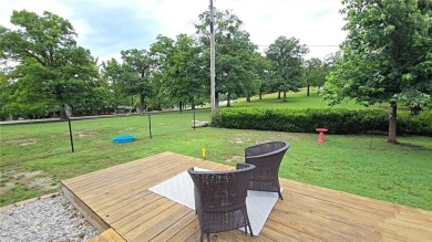 Sitting on 1.55 pristine, park-like acres within walking on Holiday Island Executive Golf Course in Arkansas - for sale on GolfHomes.com, golf home, golf lot