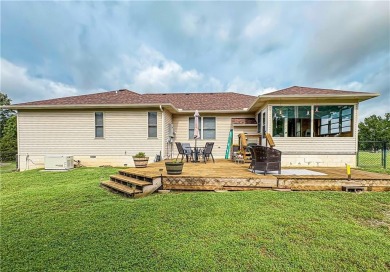 Sitting on 1.55 pristine, park-like acres within walking on Holiday Island Executive Golf Course in Arkansas - for sale on GolfHomes.com, golf home, golf lot