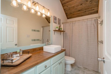 This move-in ready home is a gem on the 13th tee box. With three on Holly Lake Ranch Golf Club in Texas - for sale on GolfHomes.com, golf home, golf lot