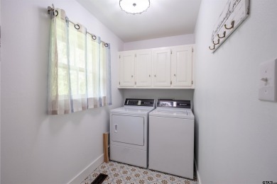 **Lakefront Charm Meets Updated Comfort in Hideaway Lake** on Hide-A-Way Lake Golf Course in Texas - for sale on GolfHomes.com, golf home, golf lot