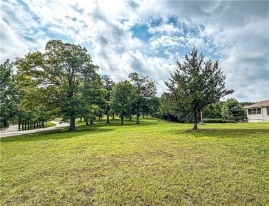 Sitting on 1.55 pristine, park-like acres within walking on Holiday Island Executive Golf Course in Arkansas - for sale on GolfHomes.com, golf home, golf lot