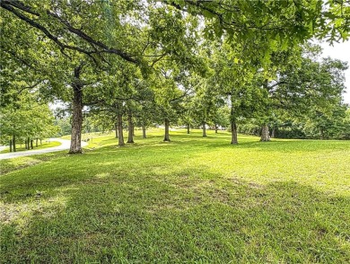 Sitting on 1.55 pristine, park-like acres within walking on Holiday Island Executive Golf Course in Arkansas - for sale on GolfHomes.com, golf home, golf lot