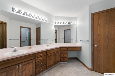 Experience the warmth of a close-knit neighborhood of around 100 on Woodland Hills Golf Course in Nebraska - for sale on GolfHomes.com, golf home, golf lot