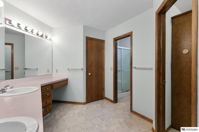 Experience the warmth of a close-knit neighborhood of around 100 on Woodland Hills Golf Course in Nebraska - for sale on GolfHomes.com, golf home, golf lot