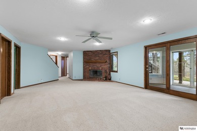 Experience the warmth of a close-knit neighborhood of around 100 on Woodland Hills Golf Course in Nebraska - for sale on GolfHomes.com, golf home, golf lot