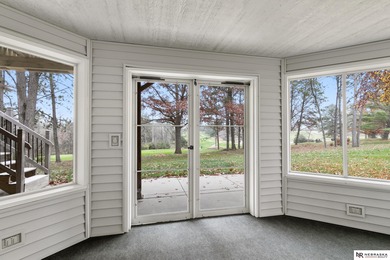 Experience the warmth of a close-knit neighborhood of around 100 on Woodland Hills Golf Course in Nebraska - for sale on GolfHomes.com, golf home, golf lot