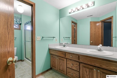 Experience the warmth of a close-knit neighborhood of around 100 on Woodland Hills Golf Course in Nebraska - for sale on GolfHomes.com, golf home, golf lot