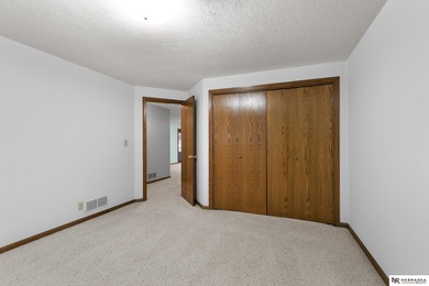 Experience the warmth of a close-knit neighborhood of around 100 on Woodland Hills Golf Course in Nebraska - for sale on GolfHomes.com, golf home, golf lot