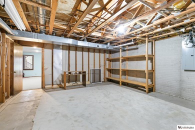 Experience the warmth of a close-knit neighborhood of around 100 on Woodland Hills Golf Course in Nebraska - for sale on GolfHomes.com, golf home, golf lot