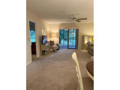 2 BR/2 BA, 1224 sq. ft. 2nd Floor Condo with Assigned Covered on Tarpon Woods Golf Club in Florida - for sale on GolfHomes.com, golf home, golf lot