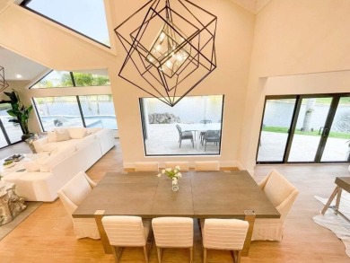 Welcome to 910 Greensward Ln, a stunning contemporary on Seagate Country Club in Florida - for sale on GolfHomes.com, golf home, golf lot