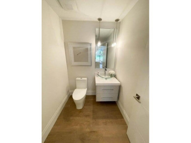 Welcome to 910 Greensward Ln, a stunning contemporary on Seagate Country Club in Florida - for sale on GolfHomes.com, golf home, golf lot