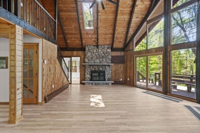 Situated on the golf course in Tanglwood Lakes, this stunning on Paupack Hills Golf and Country Club in Pennsylvania - for sale on GolfHomes.com, golf home, golf lot