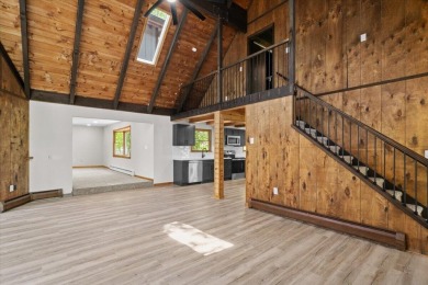 Situated on the golf course in Tanglwood Lakes, this stunning on Paupack Hills Golf and Country Club in Pennsylvania - for sale on GolfHomes.com, golf home, golf lot