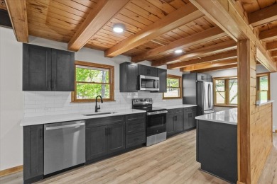 Situated on the golf course in Tanglwood Lakes, this stunning on Paupack Hills Golf and Country Club in Pennsylvania - for sale on GolfHomes.com, golf home, golf lot