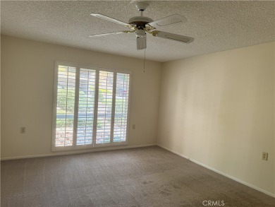 Nestled on a peaceful street, this inviting lower-level 'La on Leisure Village Par 3 Golf Course in California - for sale on GolfHomes.com, golf home, golf lot