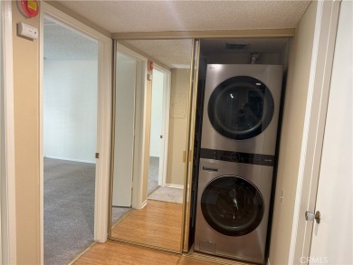 Nestled on a peaceful street, this inviting lower-level 'La on Leisure Village Par 3 Golf Course in California - for sale on GolfHomes.com, golf home, golf lot