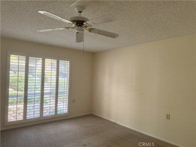 Nestled on a peaceful street, this inviting lower-level 'La on Leisure Village Par 3 Golf Course in California - for sale on GolfHomes.com, golf home, golf lot