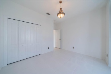 This exquisite home shows like a model. All tile floors on The Club Renaissance in Florida - for sale on GolfHomes.com, golf home, golf lot