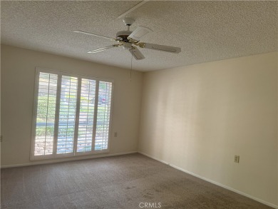 Nestled on a peaceful street, this inviting lower-level 'La on Leisure Village Par 3 Golf Course in California - for sale on GolfHomes.com, golf home, golf lot