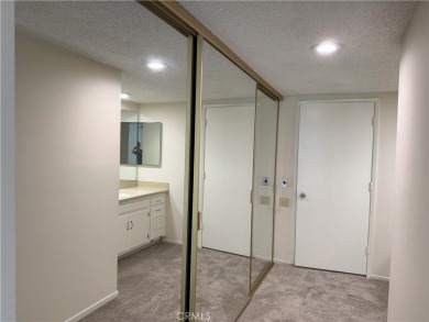 Nestled on a peaceful street, this inviting lower-level 'La on Leisure Village Par 3 Golf Course in California - for sale on GolfHomes.com, golf home, golf lot