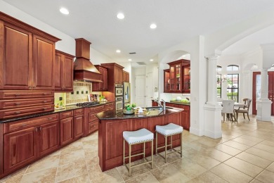 This gorgeous custom Lee Wetherington home is poised on one of on Lakewood Ranch Golf and Country Club in Florida - for sale on GolfHomes.com, golf home, golf lot