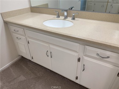 Nestled on a peaceful street, this inviting lower-level 'La on Leisure Village Par 3 Golf Course in California - for sale on GolfHomes.com, golf home, golf lot