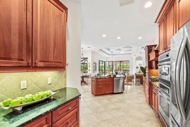 This gorgeous custom Lee Wetherington home is poised on one of on Lakewood Ranch Golf and Country Club in Florida - for sale on GolfHomes.com, golf home, golf lot