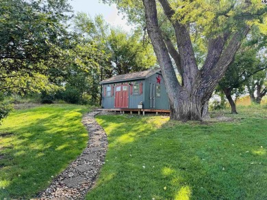 Privately set on a quiet drive, this Colorado-style home offers on Prairie Dunes Country Club in Kansas - for sale on GolfHomes.com, golf home, golf lot