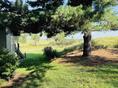 Privately set on a quiet drive, this Colorado-style home offers on Prairie Dunes Country Club in Kansas - for sale on GolfHomes.com, golf home, golf lot