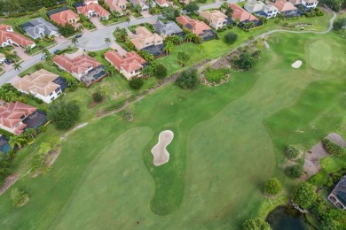 This gorgeous custom Lee Wetherington home is poised on one of on Lakewood Ranch Golf and Country Club in Florida - for sale on GolfHomes.com, golf home, golf lot