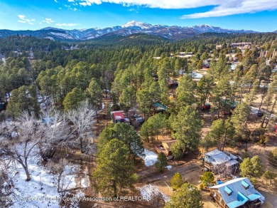 Located in the heart of Ruidoso, this 2-bedroom, 2-bath cabin is on Cree Meadows Country Club in New Mexico - for sale on GolfHomes.com, golf home, golf lot