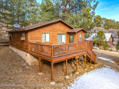 Located in the heart of Ruidoso, this 2-bedroom, 2-bath cabin is on Cree Meadows Country Club in New Mexico - for sale on GolfHomes.com, golf home, golf lot