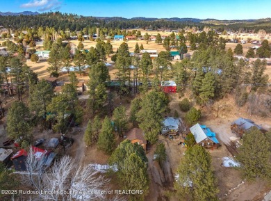 Located in the heart of Ruidoso, this 2-bedroom, 2-bath cabin is on Cree Meadows Country Club in New Mexico - for sale on GolfHomes.com, golf home, golf lot