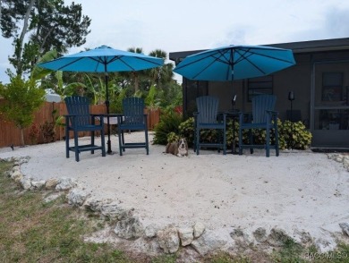 This house is located less than 1000 ft. from Three Sisters on Plantation Inn and Golf Resort  in Florida - for sale on GolfHomes.com, golf home, golf lot