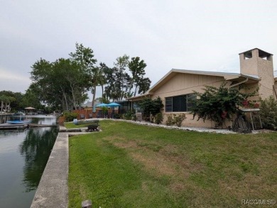 This house is located less than 1000 ft. from Three Sisters on Plantation Inn and Golf Resort  in Florida - for sale on GolfHomes.com, golf home, golf lot