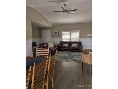 This house is located less than 1000 ft. from Three Sisters on Plantation Inn and Golf Resort  in Florida - for sale on GolfHomes.com, golf home, golf lot