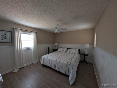 This house is located less than 1000 ft. from Three Sisters on Plantation Inn and Golf Resort  in Florida - for sale on GolfHomes.com, golf home, golf lot